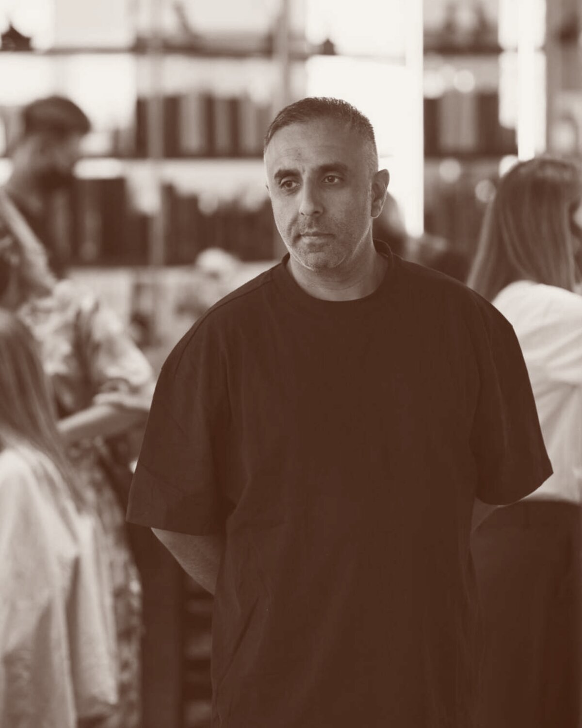 Mobeen, director, photographed against the studio wall.